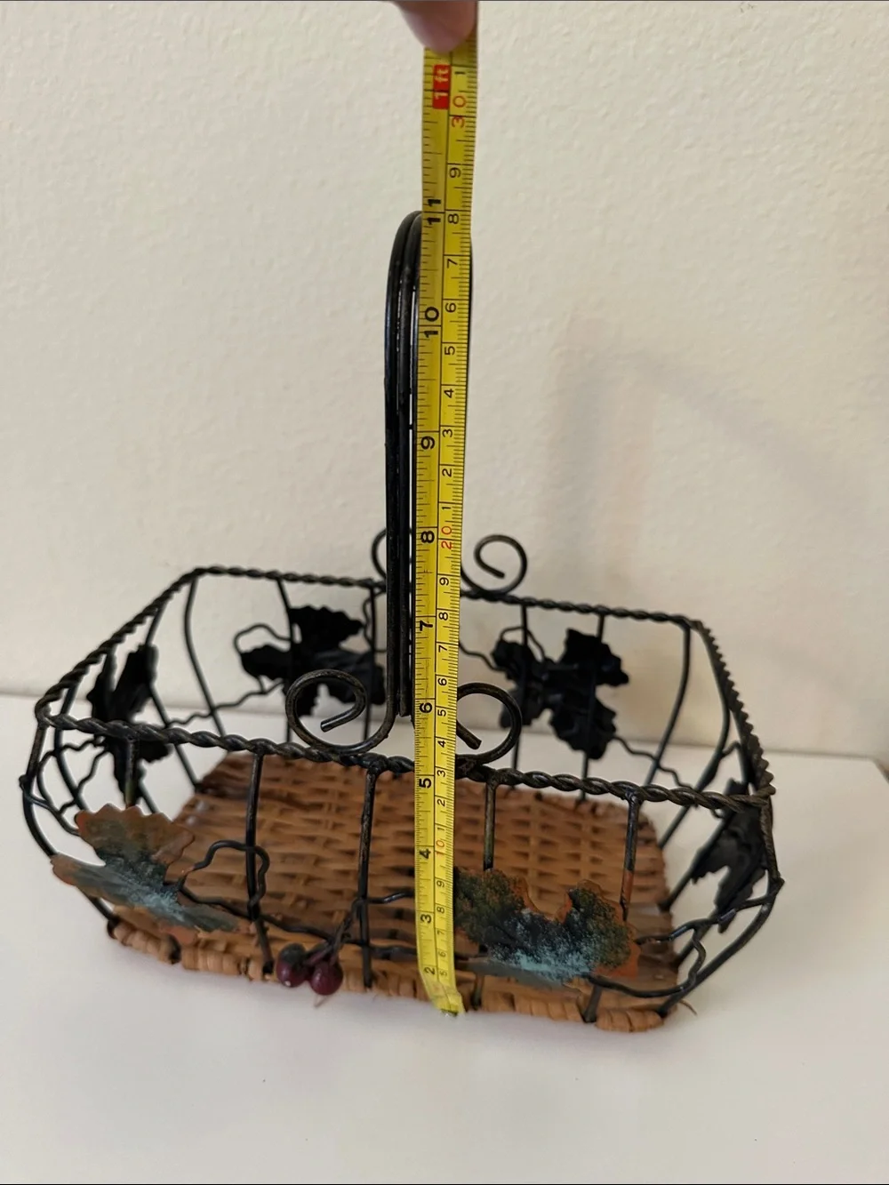 Black Metal and Brown Woven Decorative Basket with Green Leaf Accents